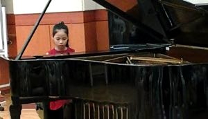 Ahe (10) took part in the ASIA International Piano Academy & Festival in Cheonan in South Korea in July 2014 and won a Bronze Prize in recognition of her outstanding performance.